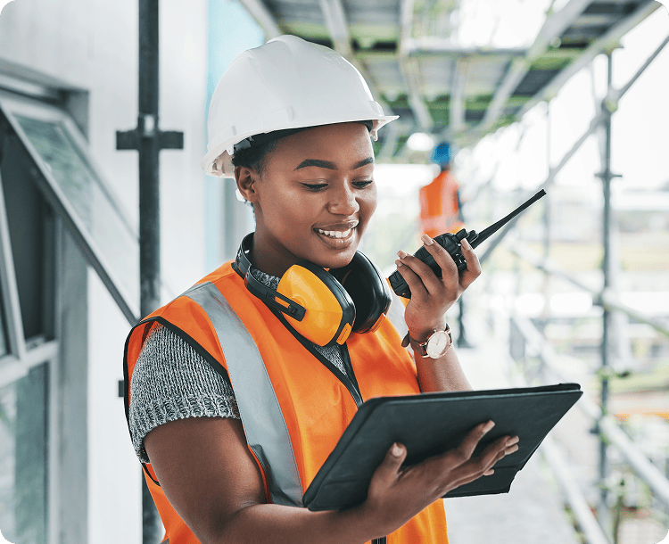 Smiling woman holding laptop